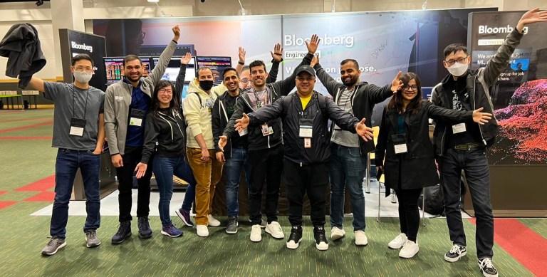 Bloomberg Group Shot at ACL 2022 in front of booth